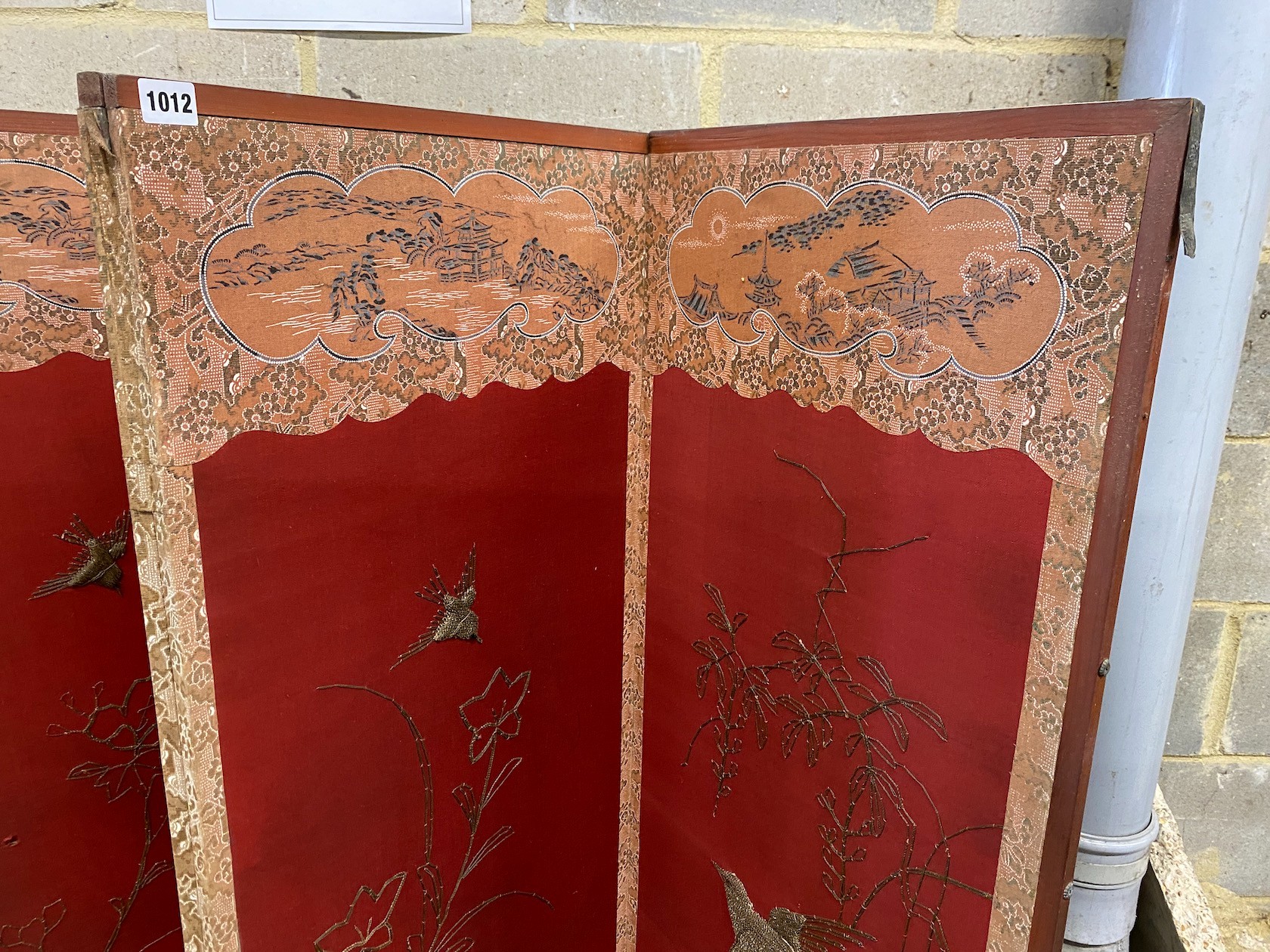 An embroidered Chinese style four fold dressing screen, each panel width 48cm, height 170cm